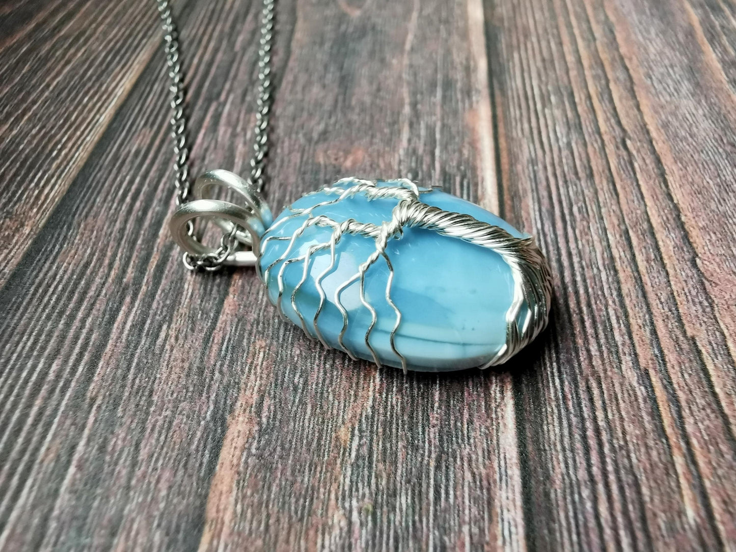 Tree pendant with a blue opal gemstone