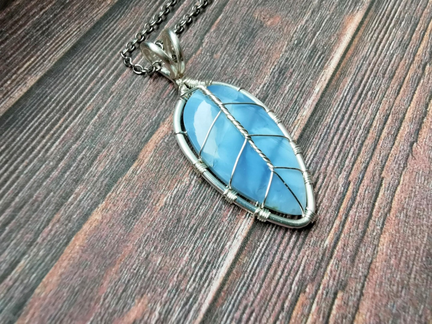 Leaf pendant with a blue opal gemstone