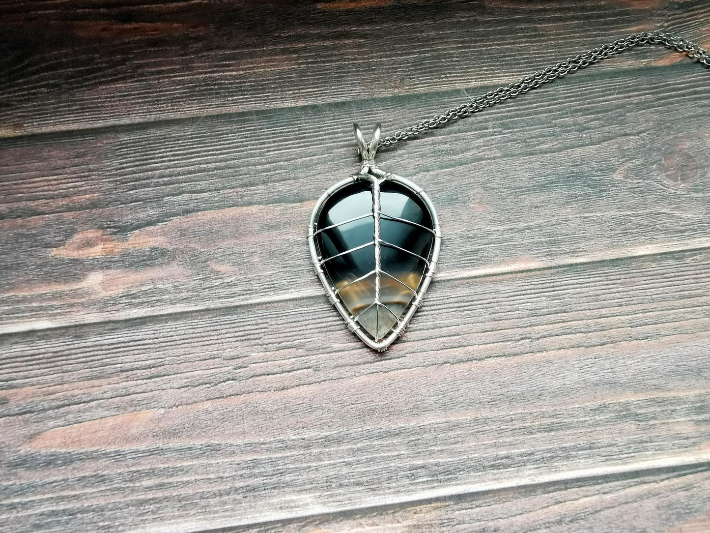 Leaf pendant with a black onyx gemstone