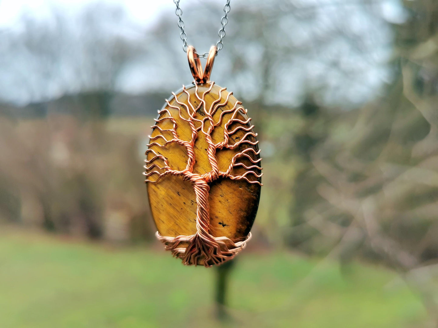 Tree pendant with a tiger's eye gemstone