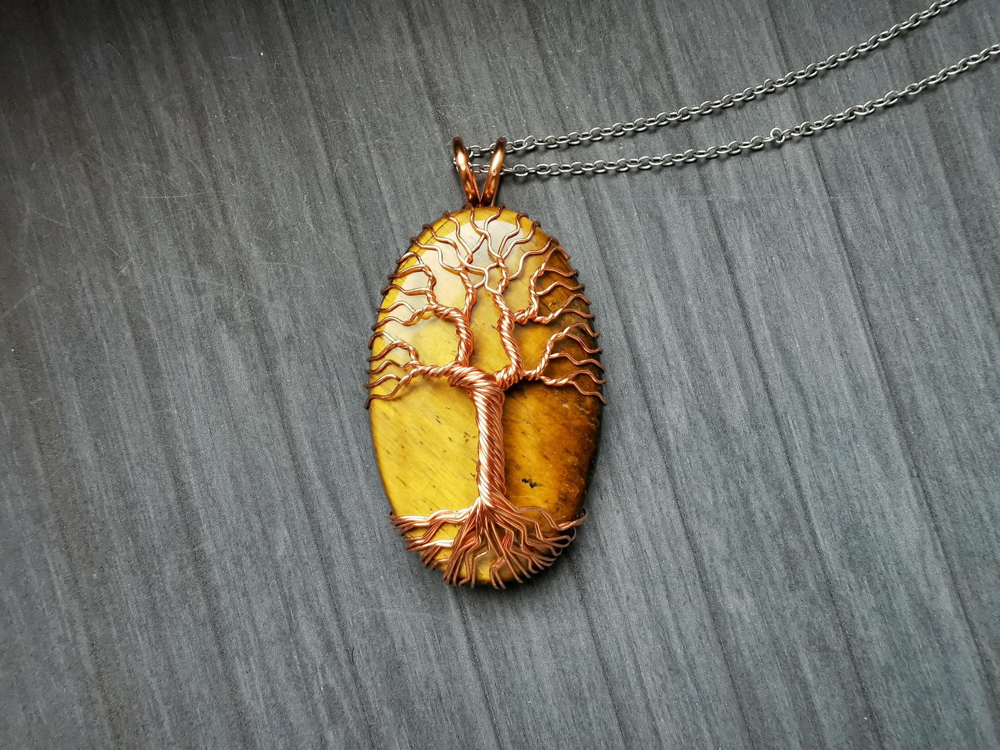 Tree pendant with a tiger's eye gemstone