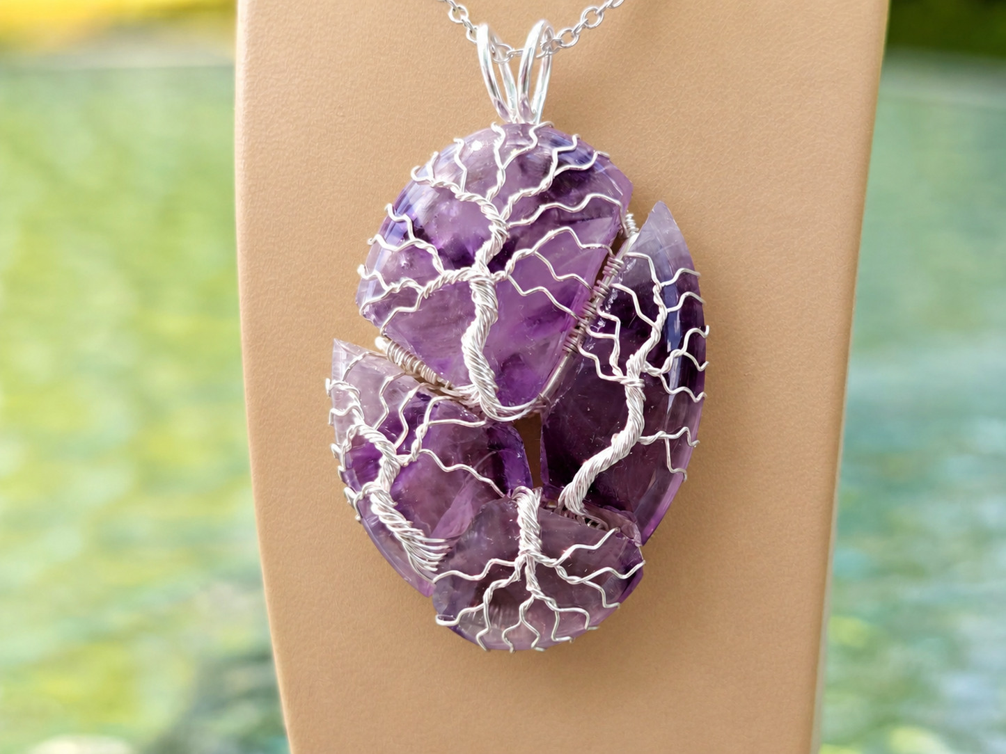 Tree pendant with a broken amethyst gemstone